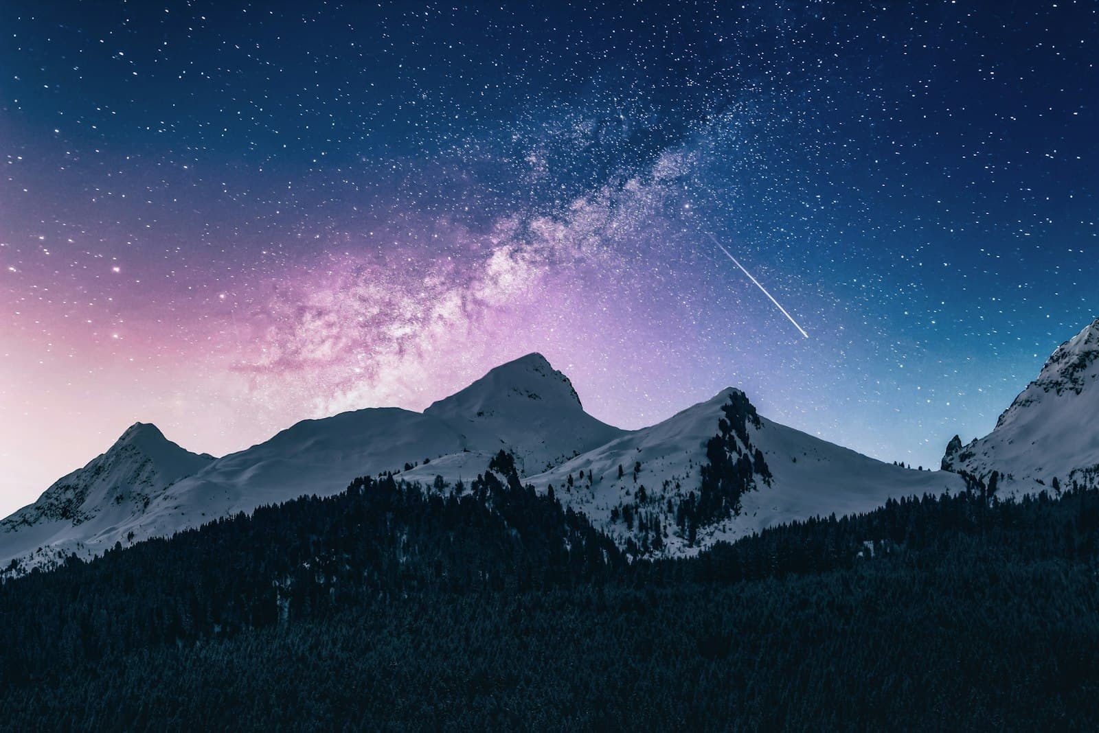 Mountain peak under a starry night sky